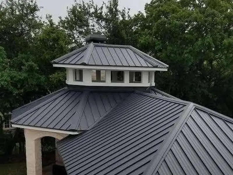 Roofer installing a metal roof in Orlando, FL